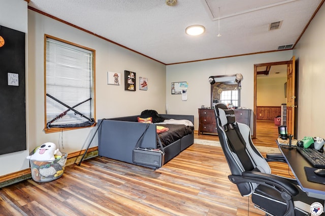 3502 Tiffany Ln, Texarkana, AR 71854 - home office featuring attic access, ornamental molding, light wood-style floors, and a textured ceiling