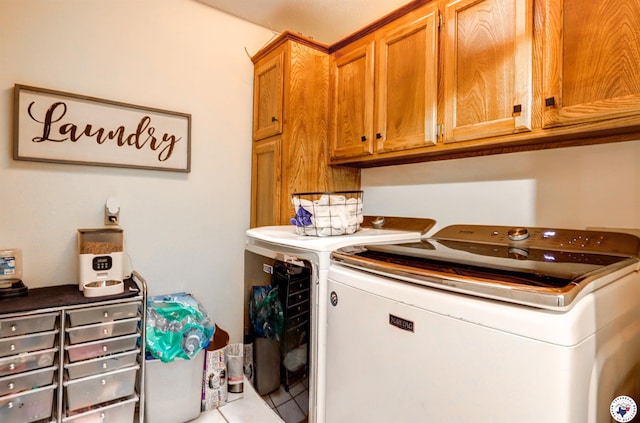 3502 Tiffany Ln, Texarkana, AR 71854 - laundry room featuring independent washer and dryer, cabinet space, and tile patterned floors