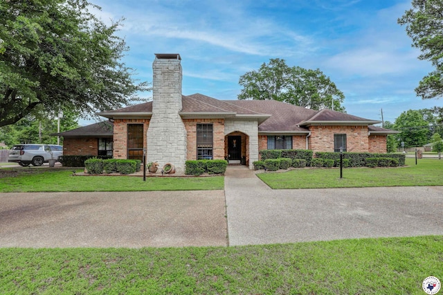3502 Tiffany Ln, Texarkana, AR 71854 - single story home with roof with shingles, a chimney, a front yard, and brick siding