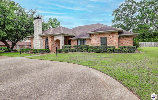 3502 Tiffany Ln, Texarkana, AR 71854 - single story home featuring roof with shingles, a chimney, and brick siding