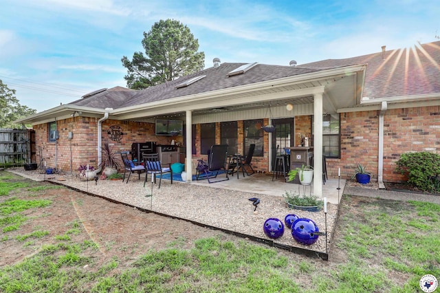 3502 Tiffany Ln, Texarkana, AR 71854 - back of house with a patio, brick siding, and a shingled roof
