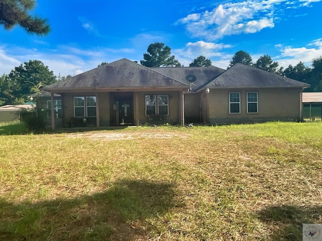 single story home featuring a front yard