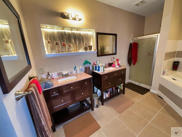 bathroom with separate shower and tub, tile patterned floors, and vanity