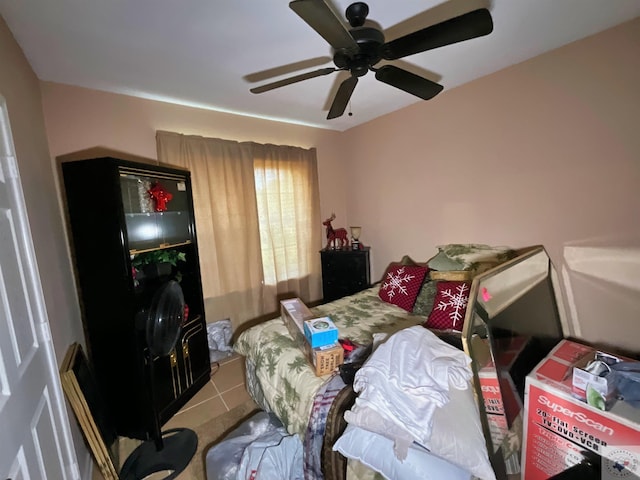 bedroom featuring ceiling fan and tile patterned floors