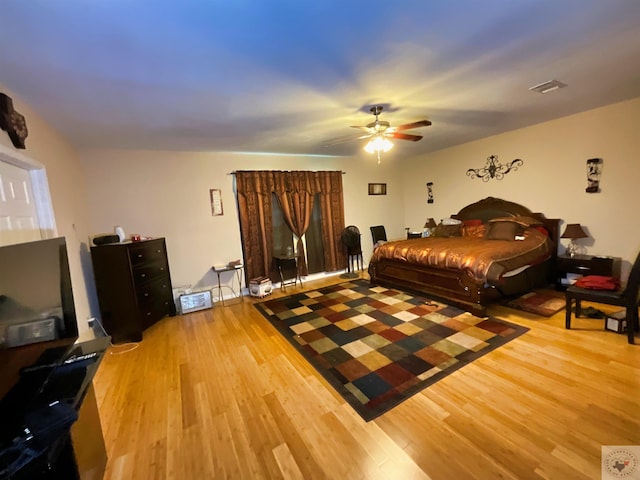 bedroom featuring light hardwood / wood-style flooring and ceiling fan