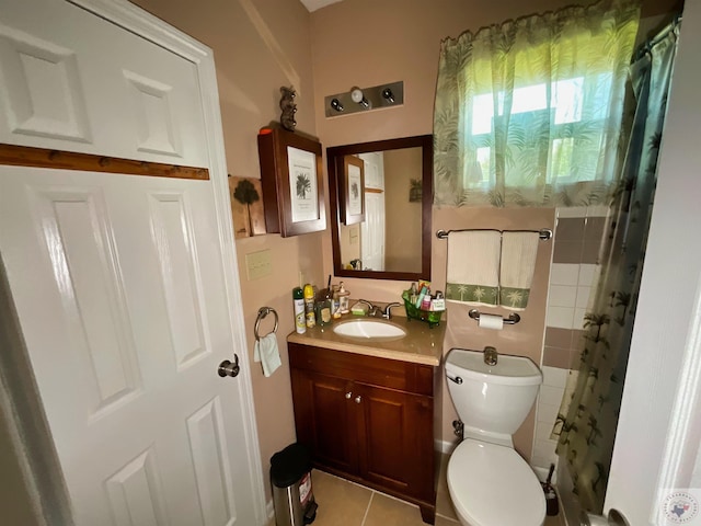 bathroom with tile patterned floors, vanity, toilet, and a shower with shower curtain