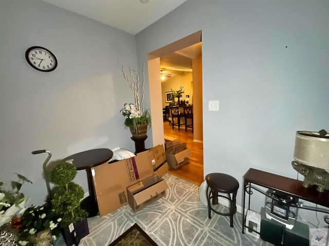 hallway with hardwood / wood-style floors