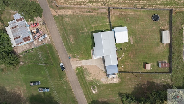 birds eye view of property with a rural view