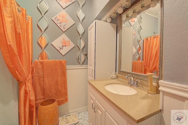 bathroom with vanity and tile patterned flooring