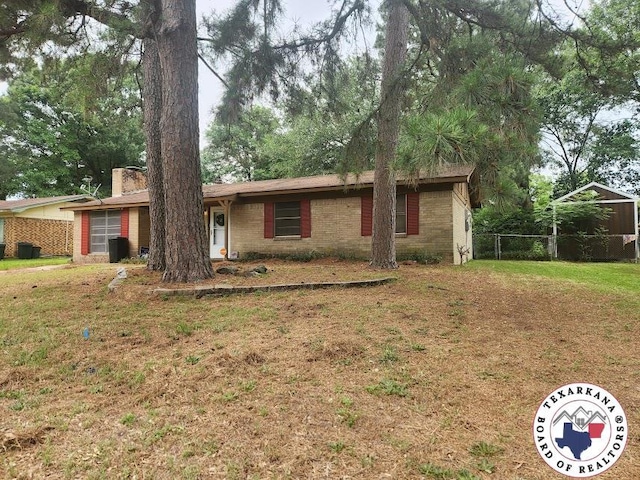 1305 E 47th St, Texarkana, AR 71854 - single story home with brick siding and a chimney