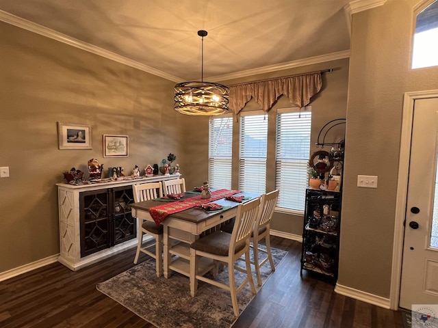 dining room featuring a chandelier, crown molding, and dark hardwood / wood-style floors