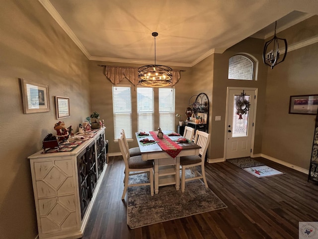 dining room featuring ornamental molding, an inviting chandelier, and dark hardwood / wood-style flooring