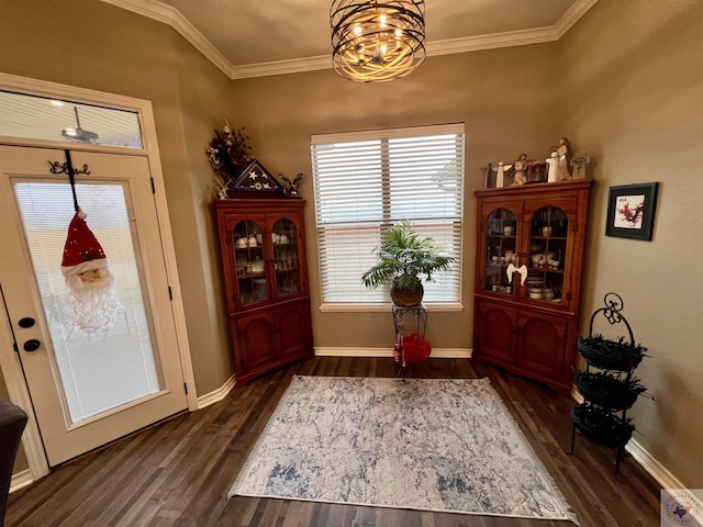 entrance foyer featuring crown molding and dark hardwood / wood-style floors