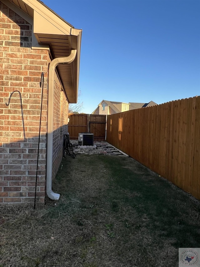 view of yard featuring central AC