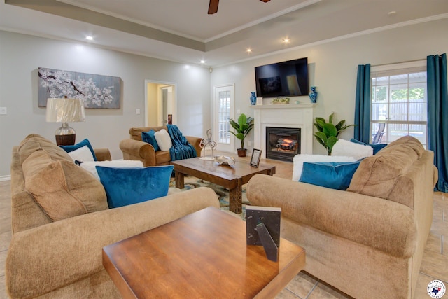 14 White Willow Pl, Texarkana, AR 71854 - tiled living room featuring a glass covered fireplace, ceiling fan, ornamental molding, recessed lighting, and a raised ceiling
