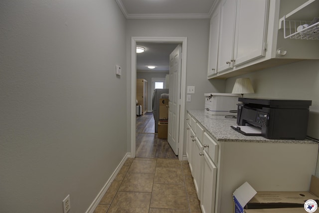 14 White Willow Pl, Texarkana, AR 71854 - kitchen with white cabinetry, tile patterned floors, crown molding, and light stone countertops