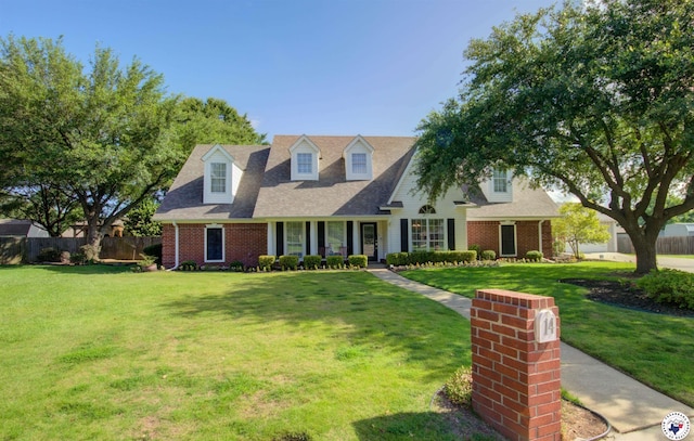 14 White Willow Pl, Texarkana, AR 71854 - cape cod home featuring brick siding, a porch, and roof with shingles