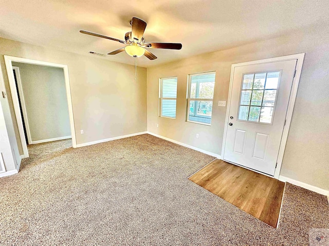 interior space featuring ceiling fan