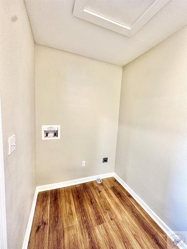 clothes washing area featuring washer hookup and wood-type flooring