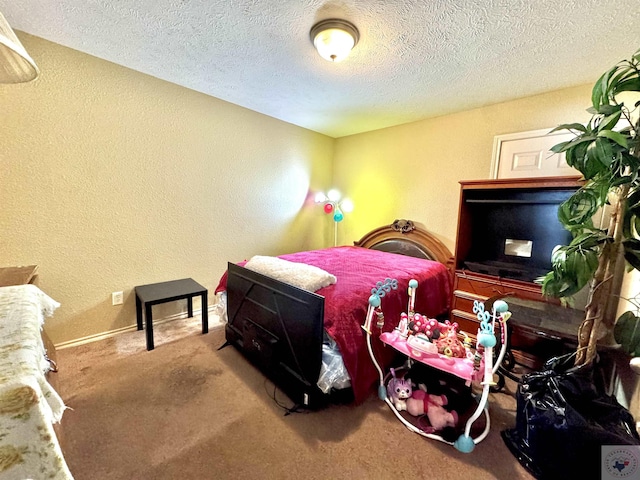 carpeted bedroom featuring a textured ceiling