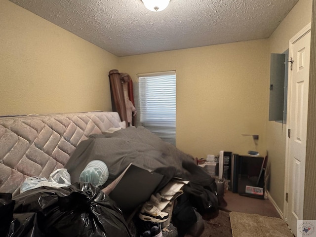 unfurnished bedroom with a textured ceiling and carpet flooring