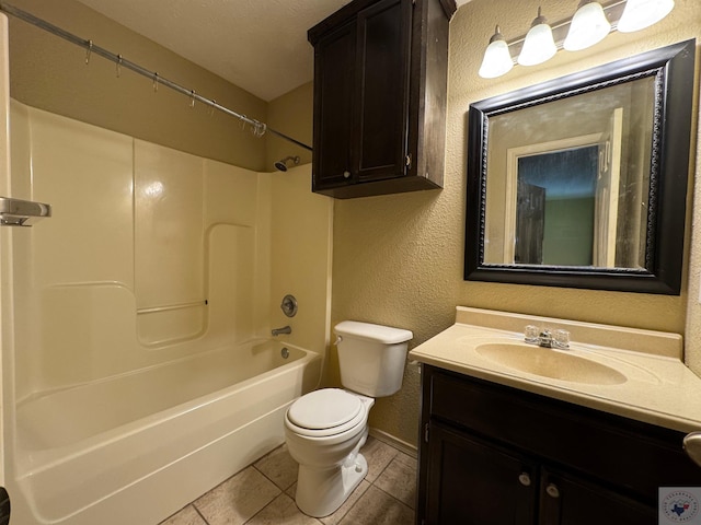 full bathroom featuring vanity, shower / tub combination, tile patterned floors, and toilet