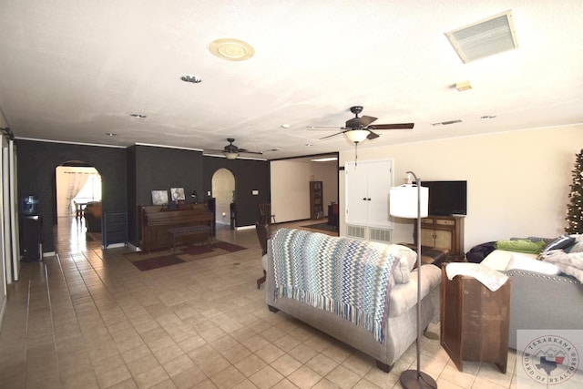 living room featuring ceiling fan and light tile patterned floors