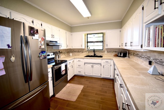 kitchen with backsplash, sink, white cabinetry, and appliances with stainless steel finishes