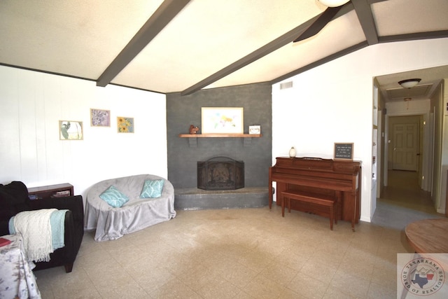 living room with a large fireplace and vaulted ceiling with beams