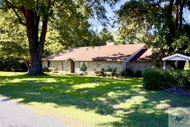 ranch-style house with a front lawn