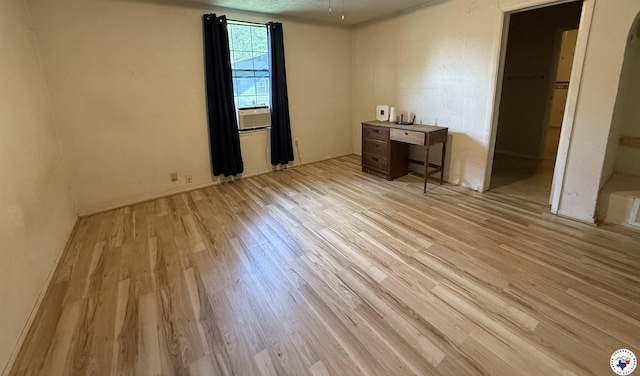 620 E 27th St, Texarkana, AR 71854 - unfurnished bedroom featuring wood finished floors and cooling unit