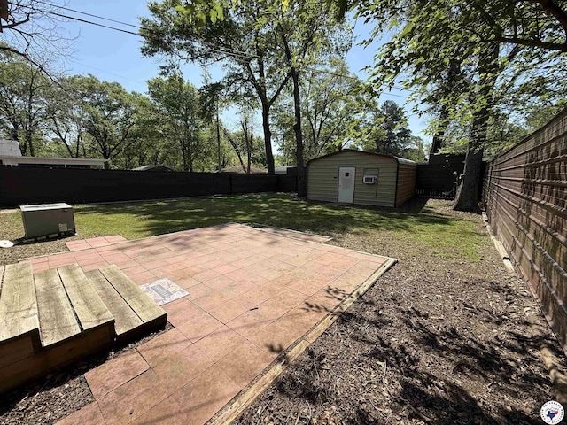 620 E 27th St, Texarkana, AR 71854 - fenced backyard with a patio and a storage shed