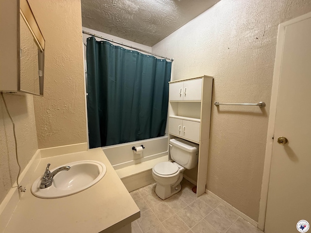 620 E 27th St, Texarkana, AR 71854 - bathroom with a textured wall, vanity, a textured ceiling, tile patterned floors, and shower / bath combo
