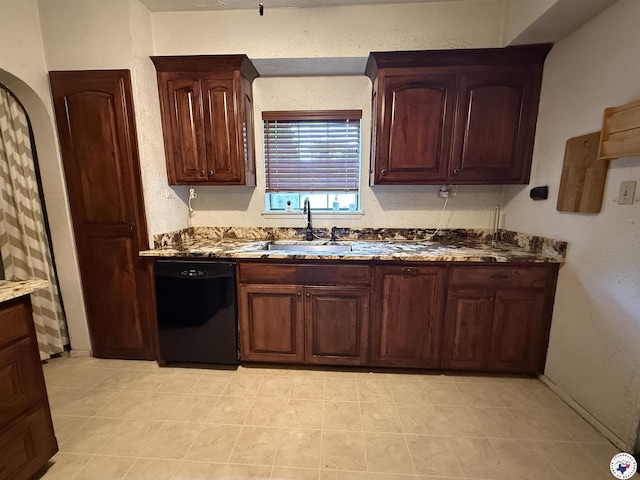 620 E 27th St, Texarkana, AR 71854 - kitchen with dishwasher, light tile patterned flooring, and stone countertops