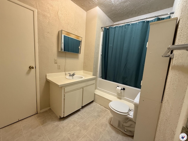620 E 27th St, Texarkana, AR 71854 - full bath featuring a textured wall, vanity, shower / tub combo, a textured ceiling, and tile patterned flooring