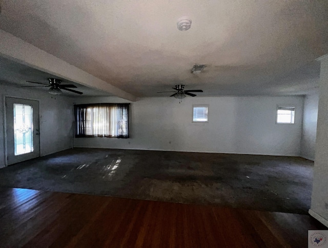 spare room with ceiling fan, dark hardwood / wood-style floors, and a textured ceiling