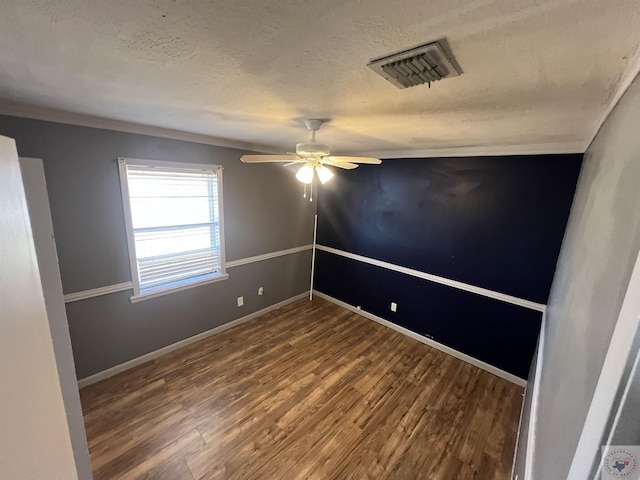 unfurnished room with ceiling fan, hardwood / wood-style flooring, and a textured ceiling