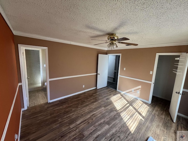 unfurnished bedroom featuring a closet, crown molding, and dark hardwood / wood-style floors