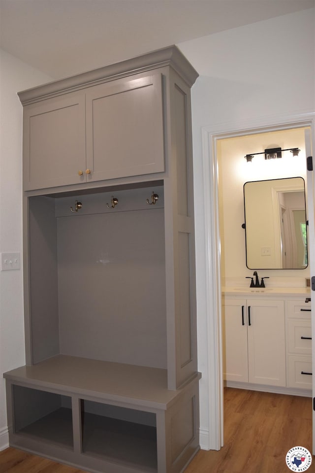 105 Bronco, Texarkana, TX 75503 - mudroom with light wood-style flooring and a sink