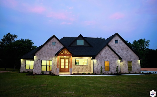 105 Bronco, Texarkana, TX 75503 - view of front of property with french doors, brick siding, and a front lawn