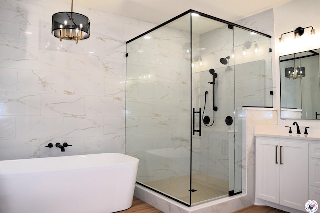105 Bronco, Texarkana, TX 75503 - bathroom featuring a shower stall, a soaking tub, wood finished floors, vanity, and tile walls