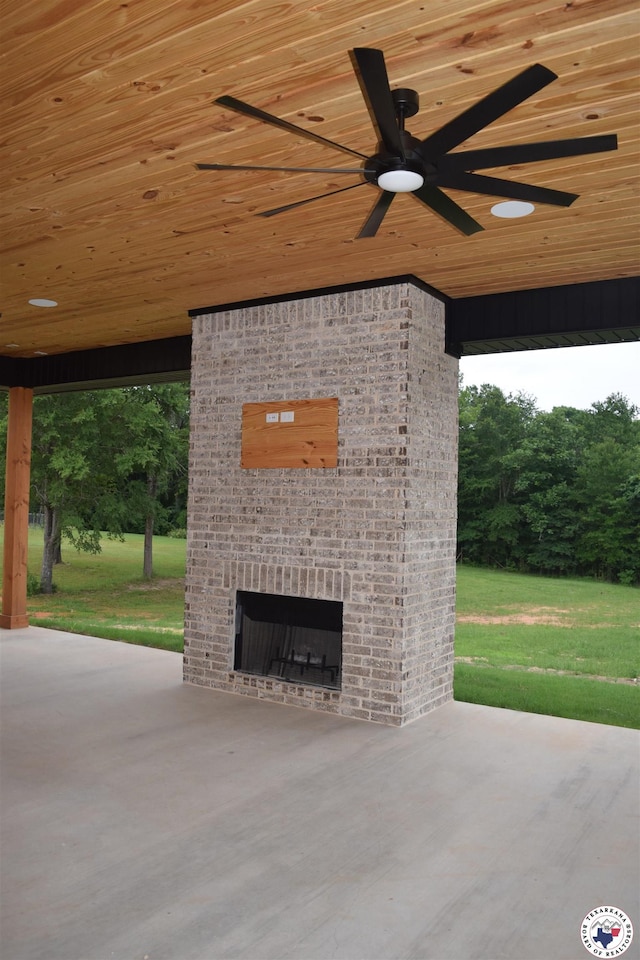 105 Bronco, Texarkana, TX 75503 - view of patio / terrace featuring a ceiling fan and an outdoor brick fireplace