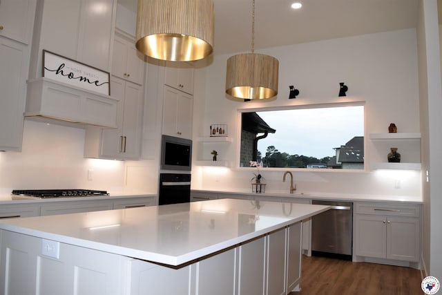 105 Bronco, Texarkana, TX 75503 - kitchen with open shelves, stainless steel appliances, a sink, light countertops, and recessed lighting