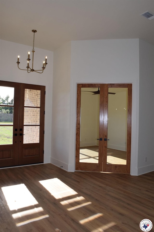 105 Bronco, Texarkana, TX 75503 - entryway featuring french doors, wood finished floors, a chandelier, and baseboards