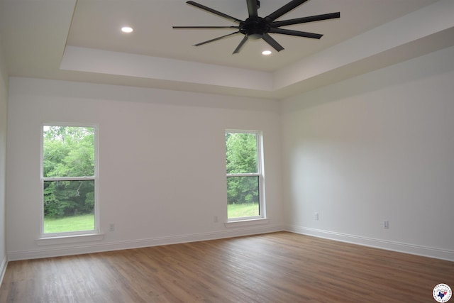 105 Bronco, Texarkana, TX 75503 - spare room with plenty of natural light, wood finished floors, baseboards, ceiling fan, and recessed lighting