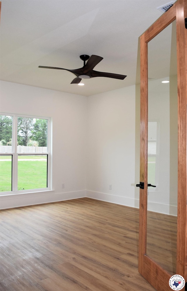 105 Bronco, Texarkana, TX 75503 - empty room featuring a ceiling fan, wood finished floors, and baseboards