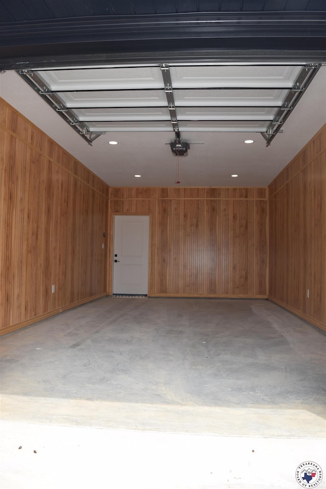 105 Bronco, Texarkana, TX 75503 - garage with wooden walls, a garage door opener, and recessed lighting