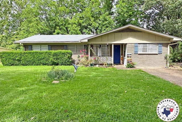 5 Sidney Dr, Texarkana, TX 75503 - view of front of property with brick siding, a front lawn, and covered porch