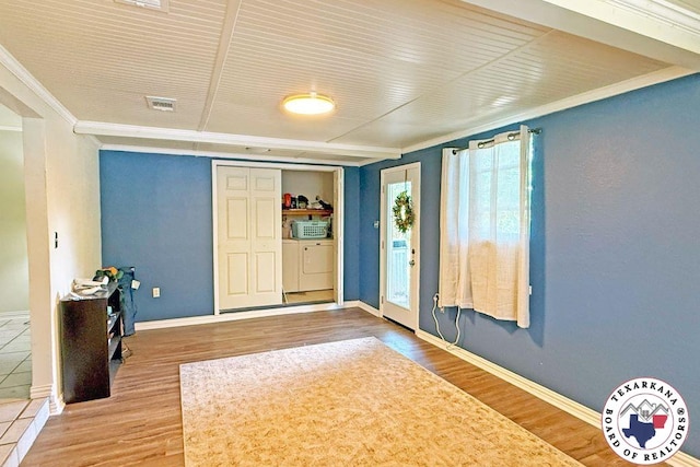 5 Sidney Dr, Texarkana, TX 75503 - foyer with washing machine and dryer, crown molding, wood finished floors, and baseboards
