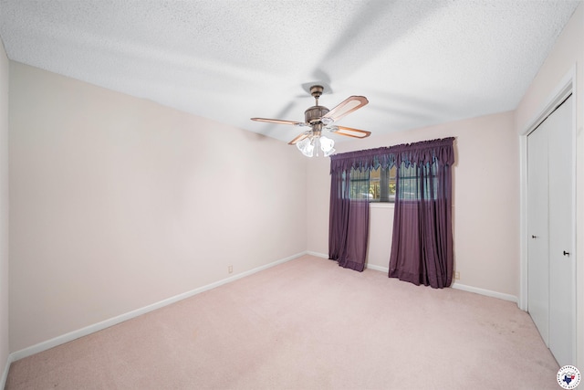 6514 Buchanan Loop, Texarkana, TX 75501 - unfurnished bedroom with light carpet, a textured ceiling, a closet, and a ceiling fan